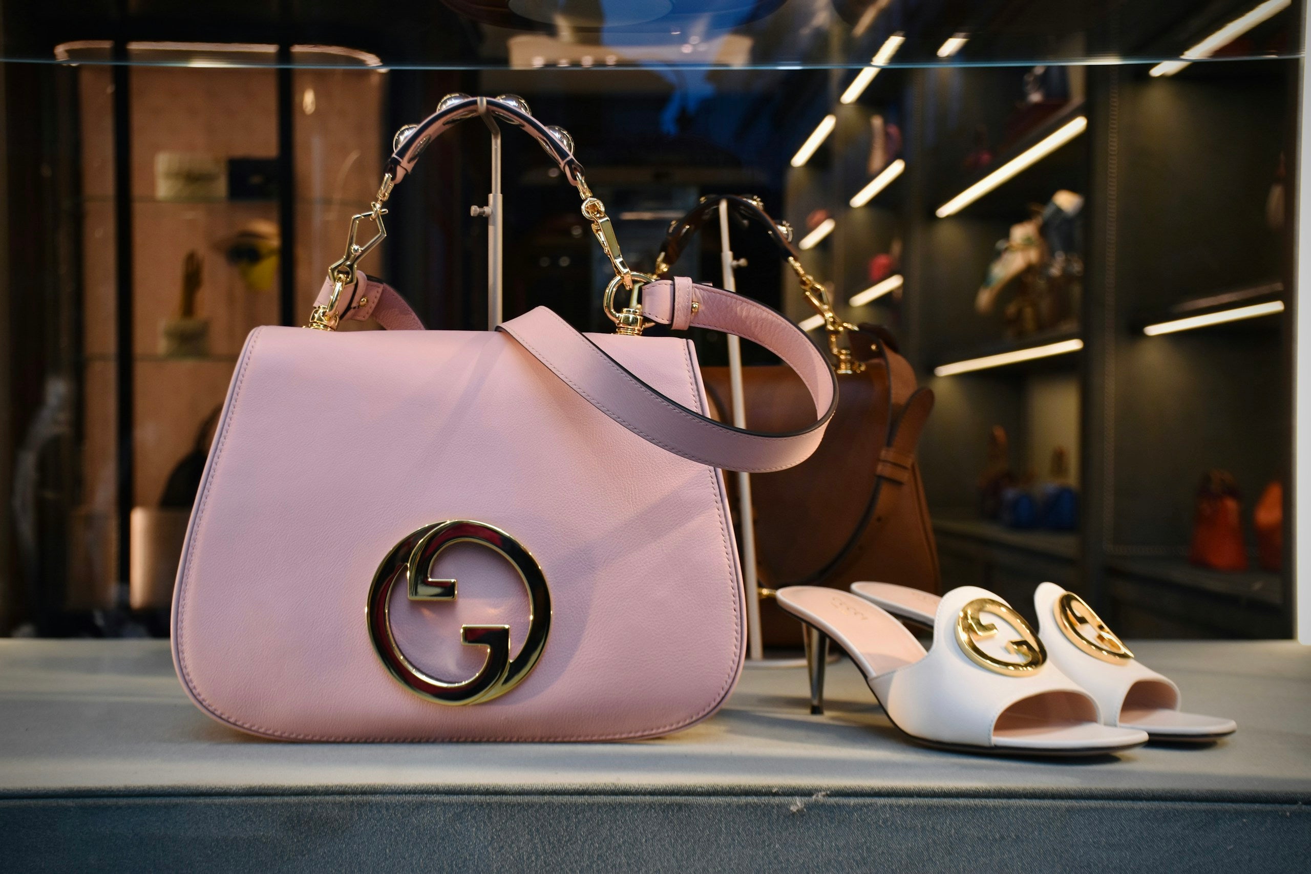 Designer handbags and accessories on display